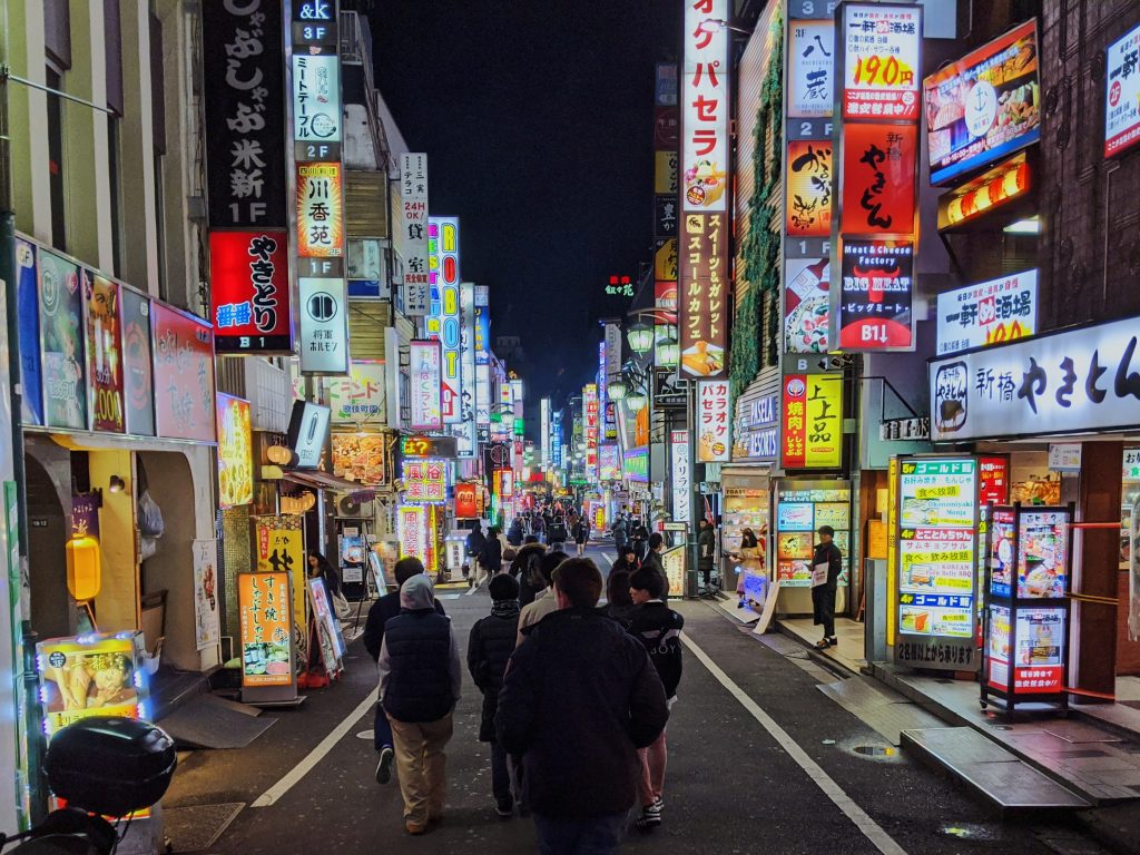 View of a street containing multiple Zakkyo buildings.