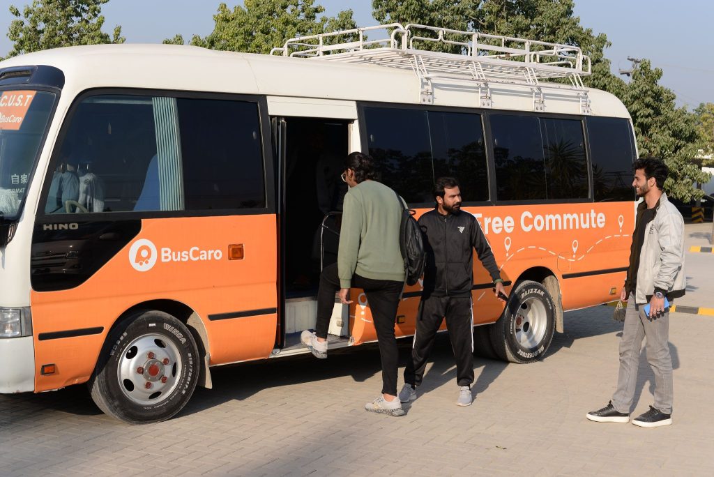 Commuters boarding a BusCaro minibus