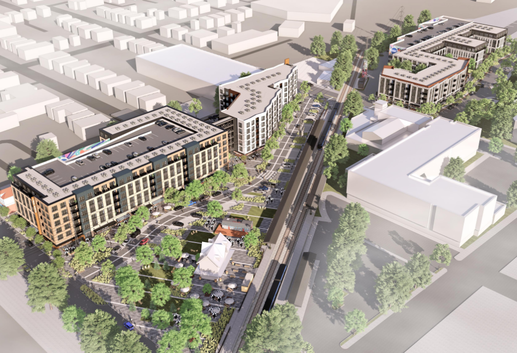 Rendering of the Red Bank redevelopment. Three large buildings with green space surrounding the transit station