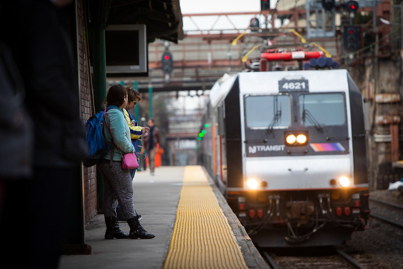 People waiting for an NJ TRANSIT train.