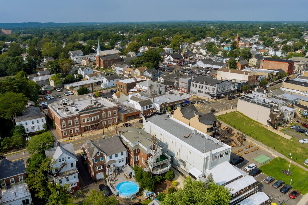 Aerial photo of East Brunswick depicting a street with single-family housing.
