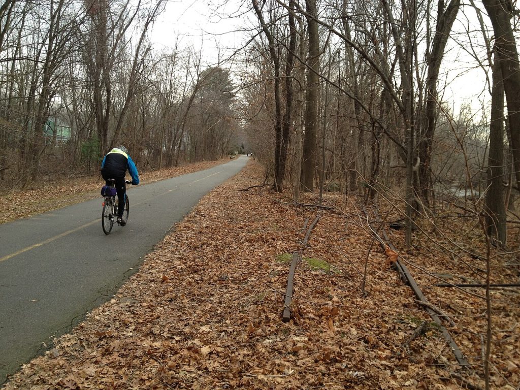 Person riding a bike on a trail.