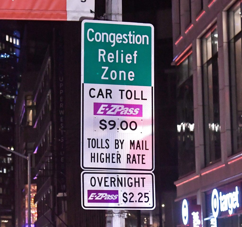 Congestion Relief Zone sign in midtown Manhattan that informs about the $9.00 Car Toll.
