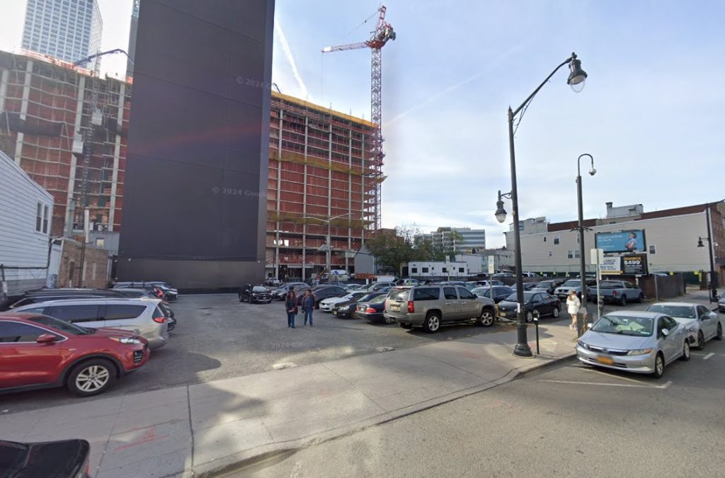 Parking lot at 701 Newark Ave, site of future development.