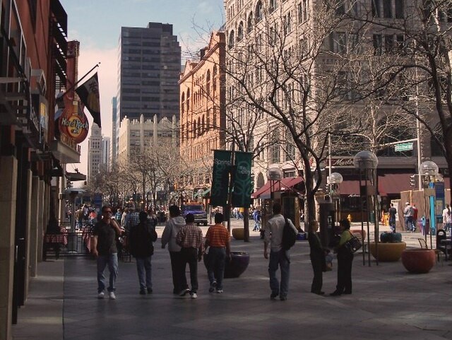 People walking on a pedestrian street in downtown Denver.