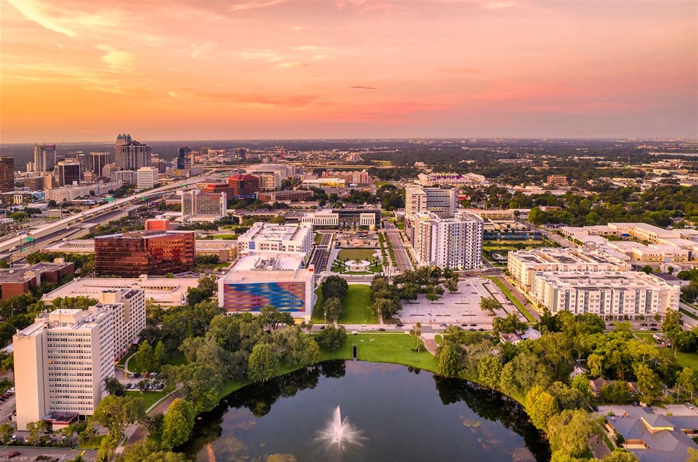 Aerial view of Creative Village in Orlando, FL. The development includes apartments, townhomes, and transit access.
