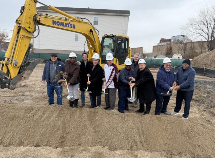 Officials celebrating the groundbreaking.