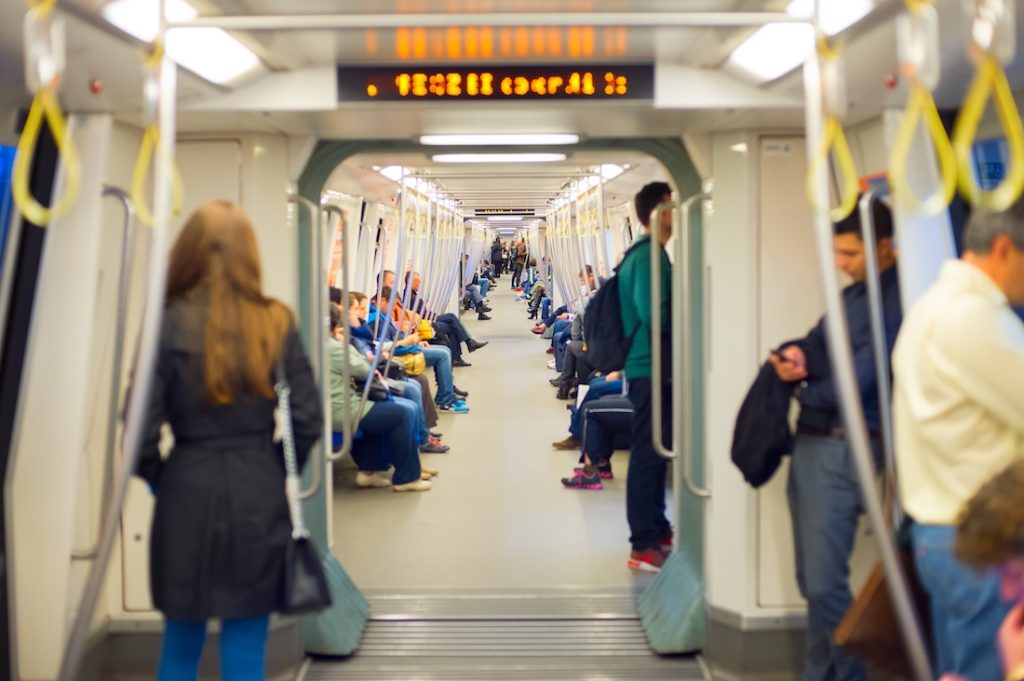 Passengers riding the Bucharest Metro.