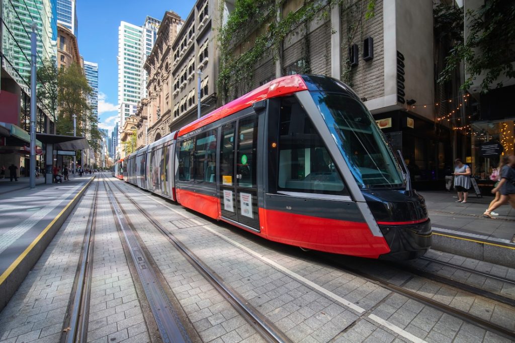 Tram moving through George Street in Sydney.