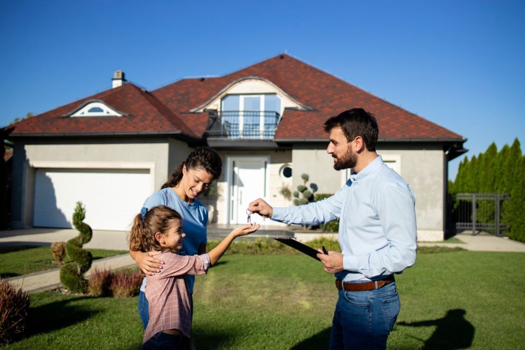Stock photo of family purchasing a single-family home