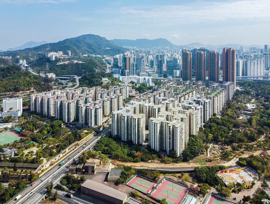 Massive megablock city surrounding a rail line in the outskirts of Hong Kong