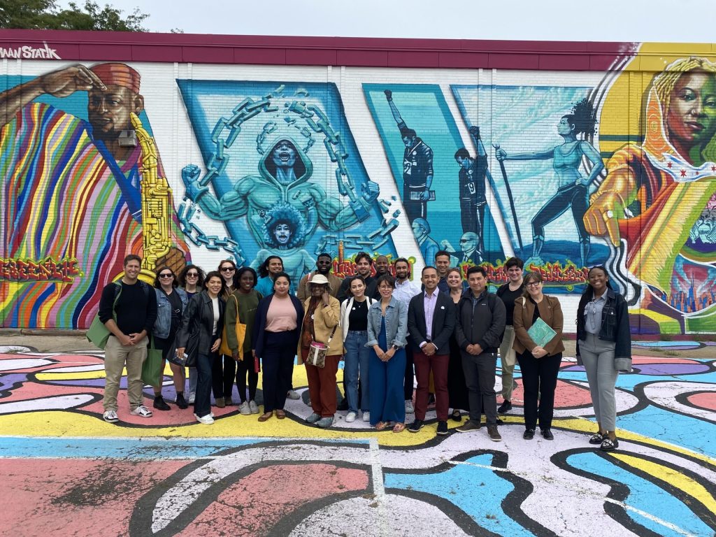 A walking tour group at a TOD mural in the Bronzeville neighborhood of Chicago, IL.