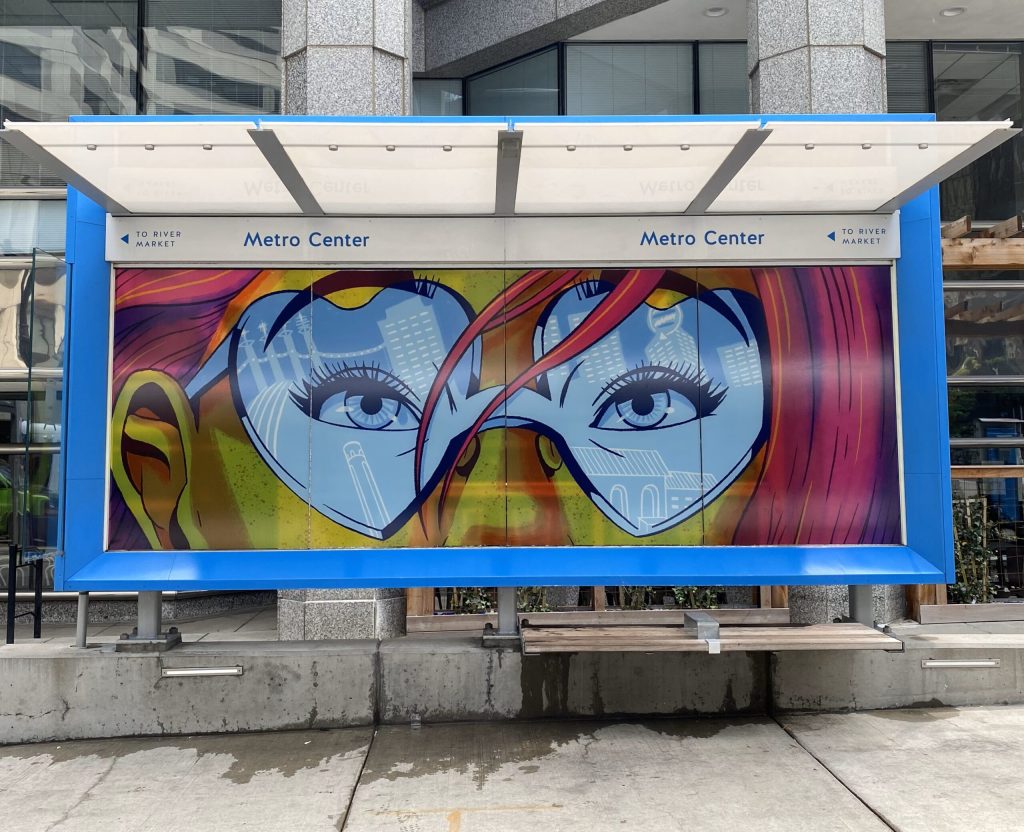 Art work of a woman wearing sunglasses at a Kansas City Streetcar Station.