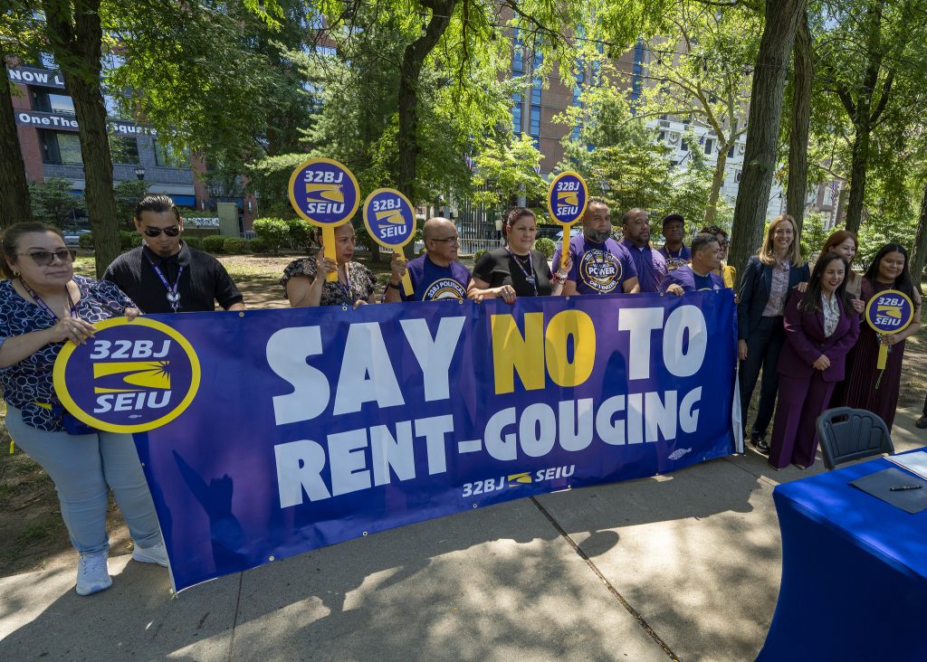 Renters supporting the FAIR Act with a large banner that says "Say No to Rent-Gouging."