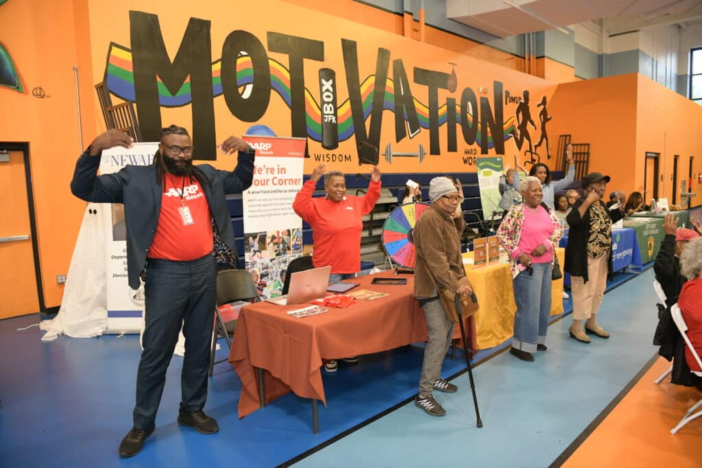 New Jersey Bike & Walk Coalition staff tabling at an event for a community challenge grant.