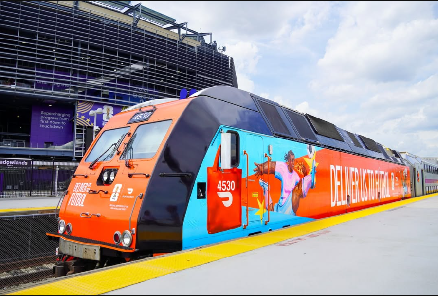 NJ TRANSIT train at Meadowlands Station decorated in a FIFA World Cup wrap