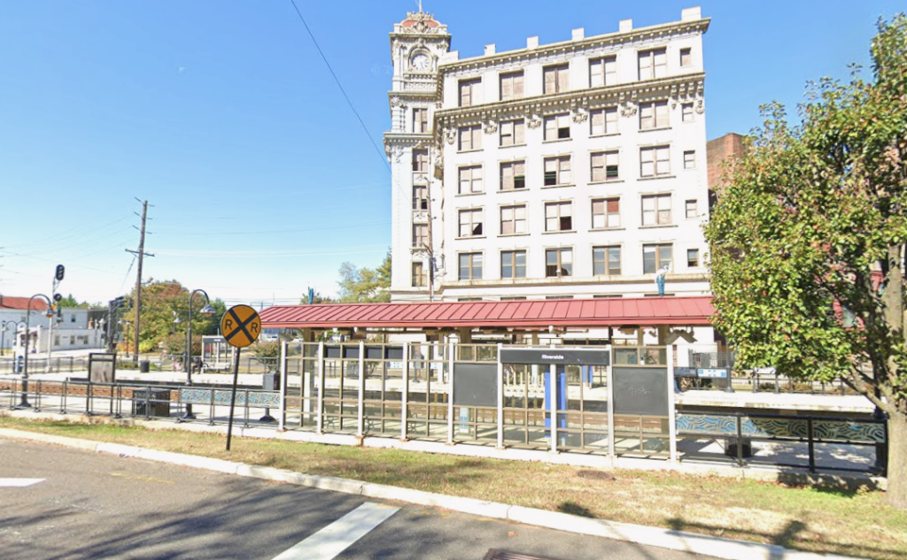 Riverside Light Rail Station with the historic Keystone Watch Case Building in the background.