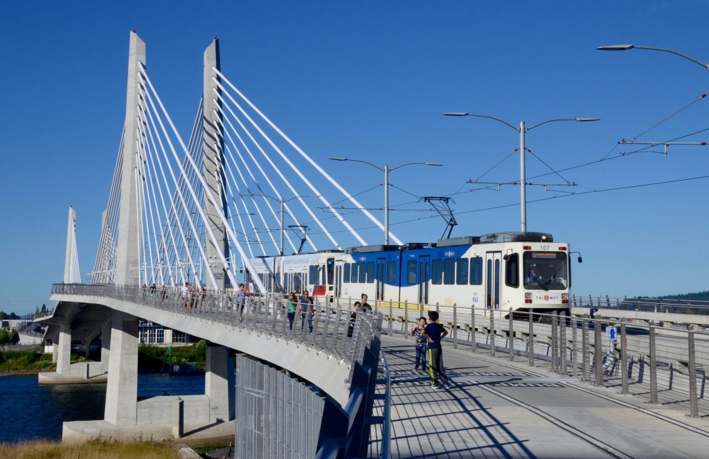MAX Train in Portland on Tilikum Crossing from north sidewalk.