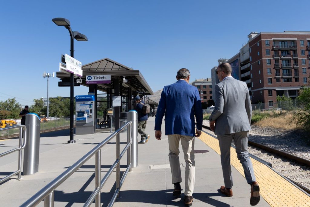Senator John Curtis at a TRAX station. 