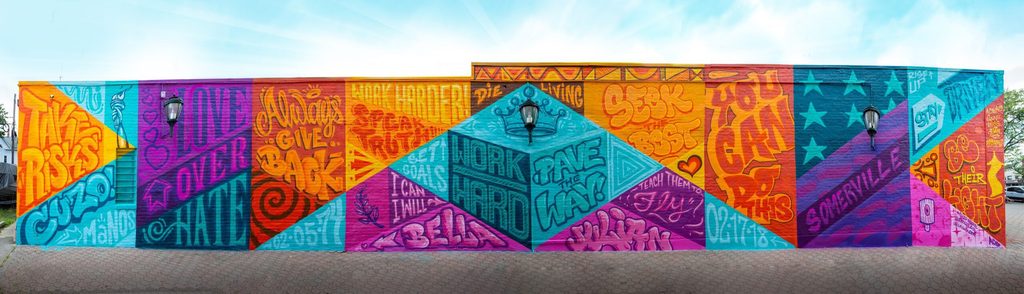 Colorful mural that includes multiple positive messages.